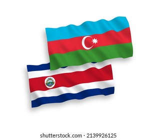 National vector fabric wave flags of Republic of Costa Rica and Azerbaijan isolated on white background. 1 to 2 proportion.