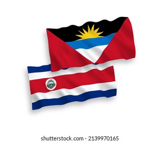 Nationale Vektor-Wellen-Flaggen der Republik Costa Rica und Antigua und Barbuda einzeln auf weißem Hintergrund. 1 bis 2 %.