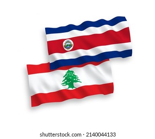 National vector fabric wave flags of Republic of Costa Rica and Lebanon isolated on white background. 1 to 2 proportion.