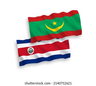 National vector fabric wave flags of Republic of Costa Rica and Islamic Republic of Mauritania isolated on white background. 1 to 2 proportion.