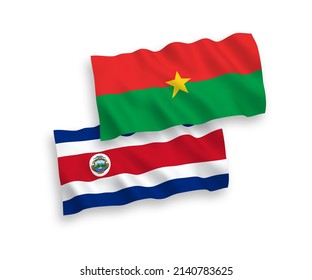 National vector fabric wave flags of Republic of Costa Rica and Burkina Faso isolated on white background. 1 to 2 proportion.