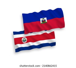 National vector fabric wave flags of Republic of Costa Rica and Republic of Haiti isolated on white background. 1 to 2 proportion.