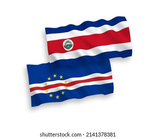 National vector fabric wave flags of Republic of Costa Rica and Republic of Cabo Verde isolated on white background. 1 to 2 proportion.