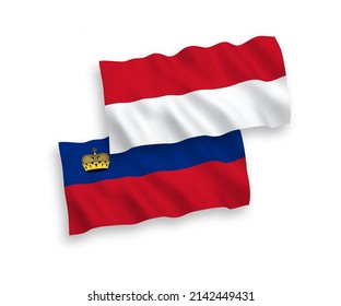 National vector fabric wave flags of Indonesia and Liechtenstein isolated on white background. 1 to 2 proportion.