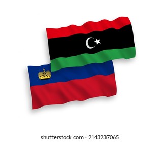 National vector fabric wave flags of Liechtenstein and Libya isolated on white background. 1 to 2 proportion.