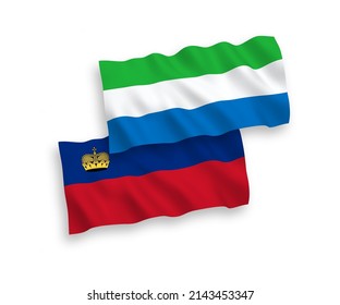 National vector fabric wave flags of Liechtenstein and Sierra Leone isolated on white background. 1 to 2 proportion.