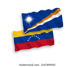 National vector fabric wave flags of Venezuela and Republic of the Marshall Islands isolated on white background. 1 to 2 proportion.