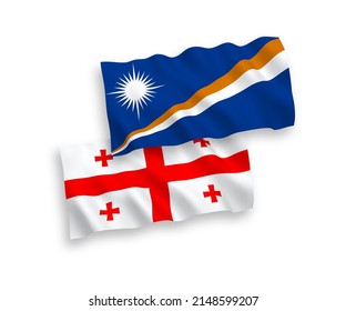 National vector fabric wave flags of Republic of the Marshall Islands and Georgia isolated on white background. 1 to 2 proportion.