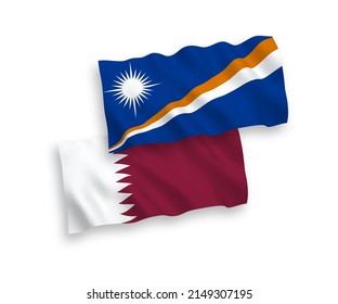 National vector fabric wave flags of Republic of the Marshall Islands and Qatar isolated on white background. 1 to 2 proportion.