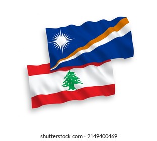 National vector fabric wave flags of Republic of the Marshall Islands and Lebanon isolated on white background. 1 to 2 proportion.