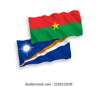 National vector fabric wave flags of Republic of the Marshall Islands and Burkina Faso isolated on white background. 1 to 2 proportion.