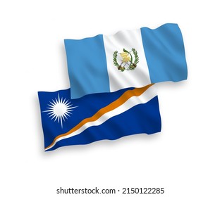 National vector fabric wave flags of Republic of the Marshall Islands and Republic of Guatemala isolated on white background. 1 to 2 proportion.