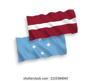 National vector fabric wave flags of Latvia and Federated States of Micronesia isolated on white background. 1 to 2 proportion.