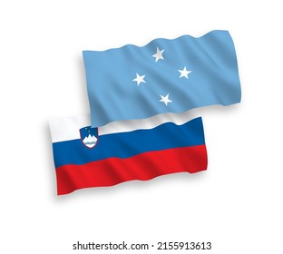 National vector fabric wave flags of Slovenia and Federated States of Micronesia isolated on white background. 1 to 2 proportion.
