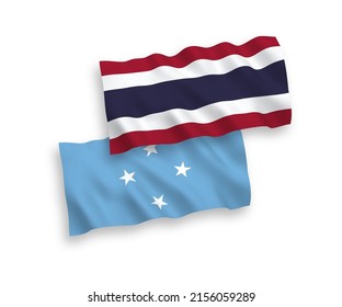 National vector fabric wave flags of Federated States of Micronesia and Thailand isolated on white background. 1 to 2 proportion.