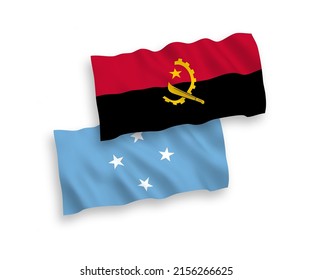 National vector fabric wave flags of Federated States of Micronesia and Angola isolated on white background. 1 to 2 proportion.