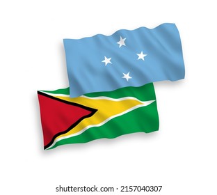 Banderas de olas de tela vectorial nacionales de los Estados Federados de Micronesia y de la República Cooperativa de Guyana aisladas de fondo blanco. de 1 a 2.