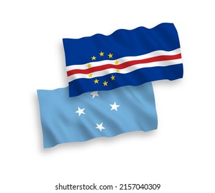 National vector fabric wave flags of Federated States of Micronesia and Republic of Cabo Verde isolated on white background. 1 to 2 proportion.