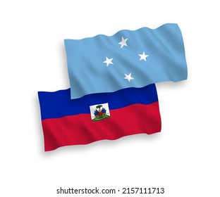 National vector fabric wave flags of Federated States of Micronesia and Republic of Haiti isolated on white background. 1 to 2 proportion.