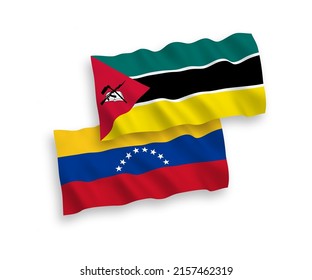 National vector fabric wave flags of Venezuela and Republic of Mozambique isolated on white background. 1 to 2 proportion.