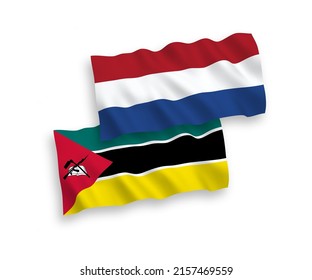 National vector fabric wave flags of Republic of Mozambique and Netherlands isolated on white background. 1 to 2 proportion.