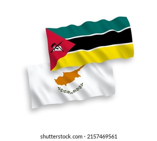 National vector fabric wave flags of Cyprus and Republic of Mozambique isolated on white background. 1 to 2 proportion.