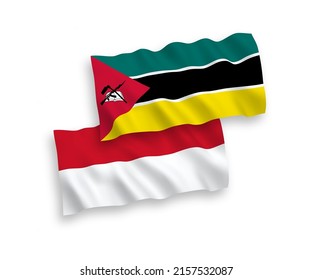 National vector fabric wave flags of Indonesia and Republic of Mozambique isolated on white background. 1 to 2 proportion.