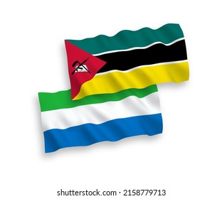 National vector fabric wave flags of Republic of Mozambique and Sierra Leone isolated on white background. 1 to 2 proportion.