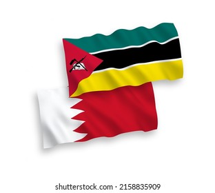 National vector fabric wave flags of Republic of Mozambique and Bahrain isolated on white background. 1 to 2 proportion.