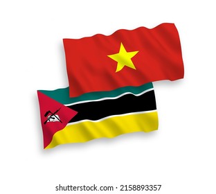 National vector fabric wave flags of Republic of Mozambique and Vietnam isolated on white background. 1 to 2 proportion.