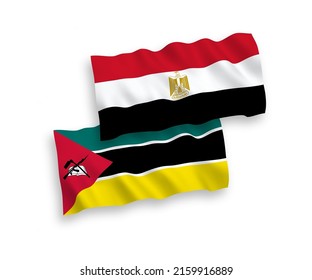 National vector fabric wave flags of Republic of Mozambique and Egypt isolated on white background. 1 to 2 proportion.