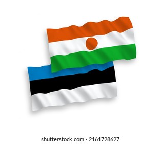 National vector fabric wave flags of Estonia and Republic of the Niger isolated on white background. 1 to 2 proportion.