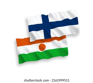 Banderas de olas de tela vectorial nacional de Finlandia y la República del Níger aisladas en fondo blanco. de 1 a 2.