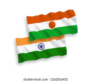 National vector fabric wave flags of India and Republic of the Niger isolated on white background. 1 to 2 proportion.