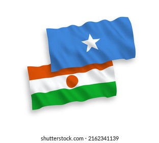National vector fabric wave flags of Republic of the Niger and Somalia isolated on white background. 1 to 2 proportion.