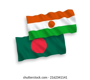 National vector fabric wave flags of Republic of the Niger and Bangladesh isolated on white background. 1 to 2 proportion.