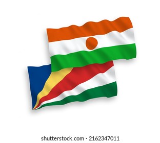 Banderas de olas de tela vectorial nacional de la República del Níger y Seychelles aisladas en fondo blanco. de 1 a 2.