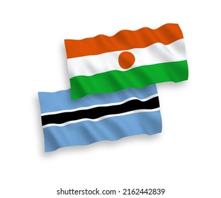 National vector fabric wave flags of Republic of the Niger and Botswana isolated on white background. 1 to 2 proportion.