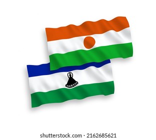 National vector fabric wave flags of Republic of the Niger and Lesotho isolated on white background. 1 to 2 proportion.