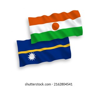 National vector fabric wave flags of Republic of the Niger and Republic of Nauru isolated on white background. 1 to 2 proportion.