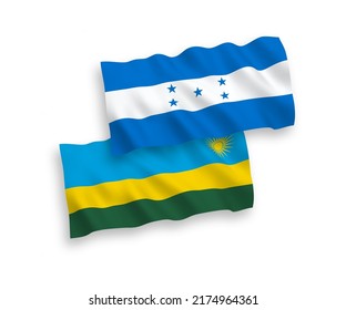 National vector fabric wave flags of Republic of Rwanda and Honduras isolated on white background. 1 to 2 proportion.