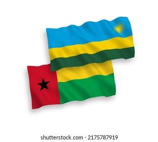National vector fabric wave flags of Republic of Rwanda and Republic of Guinea Bissau isolated on white background. 1 to 2 proportion.