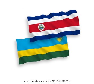 National vector fabric wave flags of Republic of Rwanda and Republic of Costa Rica isolated on white background. 1 to 2 proportion.