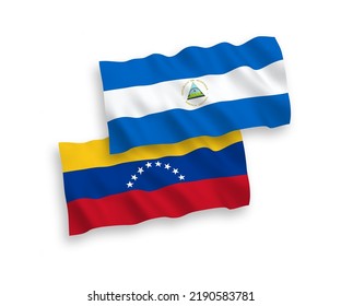 National vector fabric wave flags of Venezuela and Nicaragua isolated on white background. 1 to 2 proportion.