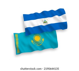 National vector fabric wave flags of Kazakhstan and Nicaragua isolated on white background. 1 to 2 proportion.