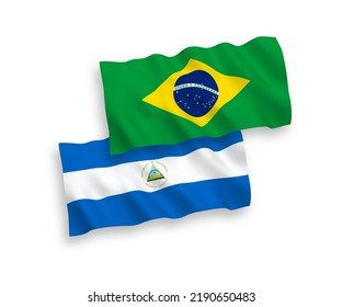 Banderas de olas de tela vectorial nacional de Brasil y Nicaragua aisladas en fondo blanco. de 1 a 2.