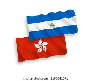 National vector fabric wave flags of Nicaragua and Hong Kong isolated on white background. 1 to 2 proportion.