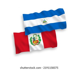 National vector fabric wave flags of Nicaragua and Peru isolated on white background. 1 to 2 proportion.