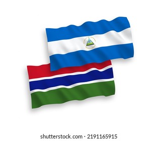 National vector fabric wave flags of Nicaragua and Republic of Gambia isolated on white background. 1 to 2 proportion.