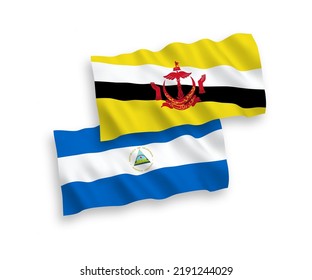 National vector fabric wave flags of Nicaragua and Brunei isolated on white background. 1 to 2 proportion.